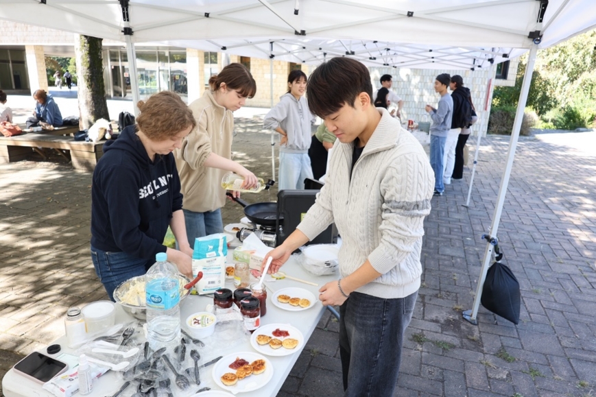 Students preparing for dishes at the festival