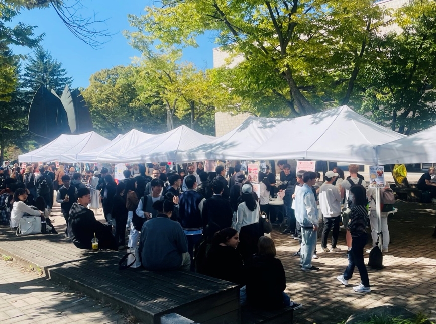 Crowds gather around food stalls, savoring flavors from around the world